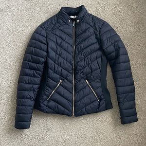 In new condition black jacket with cozy lining